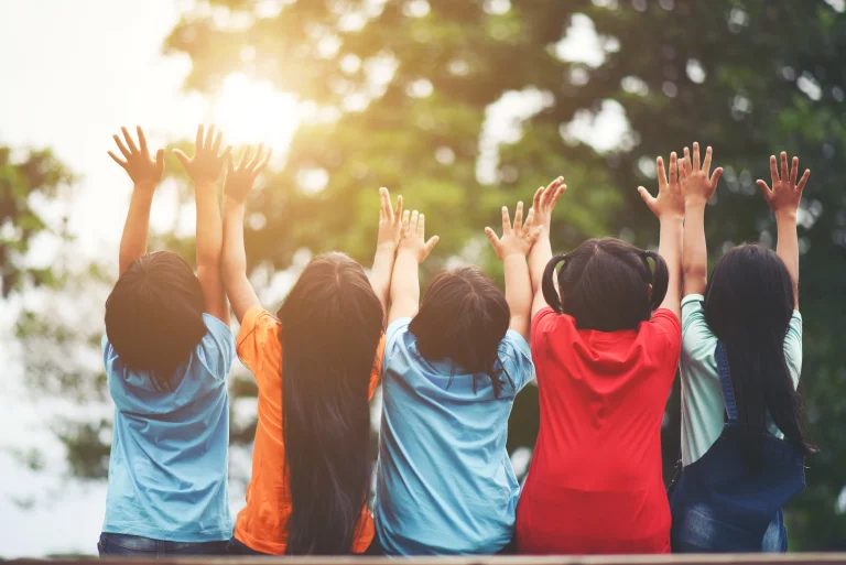 group-kids-friends-arm-around-sitting-together (1)
